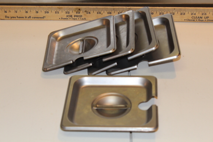 lot 101 image: 16 pan lids