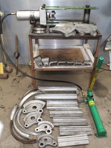 lot 313 image: Greenlee Tubing Bender w lots of die sets
