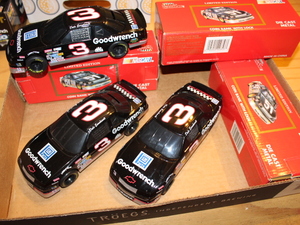 lot 43 image: Dale Earnhardt Die Cast 124 Scale Coin Bank Cars - NIB