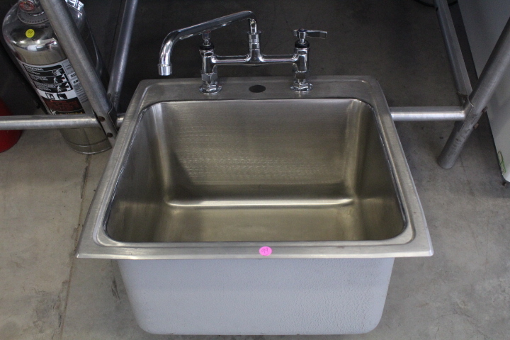 lot 99 image: Drop-in sink with faucet