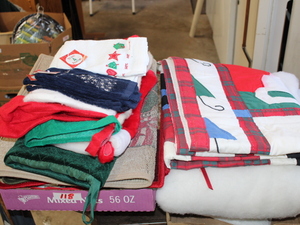 lot 118 image: Christmas Tree Skirting  Stockings  Holiday Hand Towels  Rugs  Table Cloth Lot  (Garage)