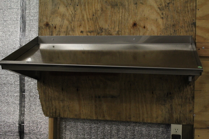 lot 67 image: Slant shelf - stainless steel