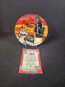 lot 74 image: Man on a Mission  6 12 Decorated Porcelain Plate Bordered in 24k gold Dale Earnhardt Jr. 1999 Hamilton Collection
