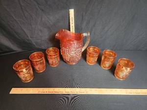 lot 6 image: Imperial Glass 8 Pitcher and 4 (6) Glasses Grape and Cable Marigold Carnival Glass