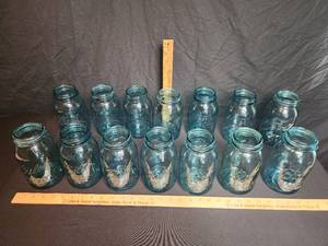 lot 56 image: 14 Blue Perfect Mason Ball Jars Bid is by the piece. 0,1,2,4,5,5,5,6,7,8,9,11,14,41 Bid amount is times 14