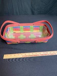 lot 143 image: 2010 Longaberger Multi Colored Bread Basket with Protector (1 signature)