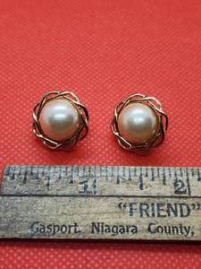 lot 47 image: Trifari Clip on earnings white center