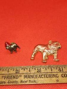 lot 41 image: Vintage Mack Truck Bulldog Pin with Firefighter Hat and Metal emblem with sticker.