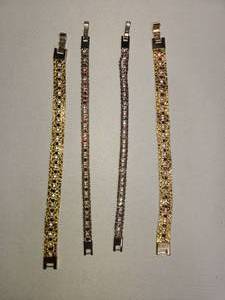 lot 89 image: lot of 4 gold tone bracelets