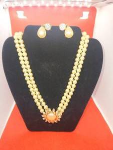 lot 139 image: Monet white bead necklace and matching clip on earrings