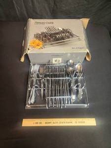 lot 99 image: Silverware and caddy