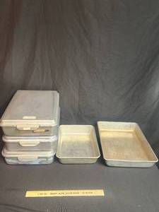 lot 106 image: Aluminum Cake pans. Some with lids
