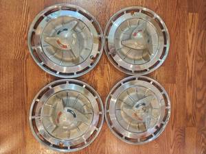 lot 15 image: lot of 4 wheel 1960s Impala aluminum hubcaps