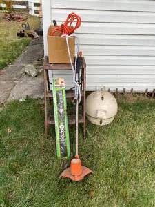 lot 72 image: Stool, Lawn Mower Blade, Electric Weed Eater, Electric Cord, Hair Dryer