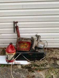 lot 75 image: Bar Oil, 1 gallon Gas Can, 7 14 Black & Decker Circular Saw,etc.