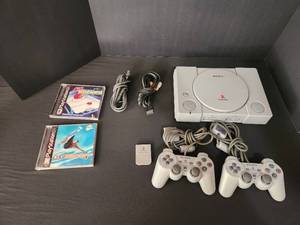 lot 1 image: Sony PlayStation Great Condition Tested and working  with Cool Borders 4, Air Hockey, OEM Memory card, ( 2 ) OEM Controllers   and OEM Cords
