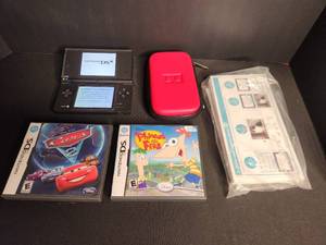 lot 5 image: Black Nintendo DSi with manual, case and 2 games with stylus