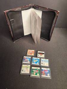 lot 15 image: Nintendo DS Game Carrying Case and 8 games.