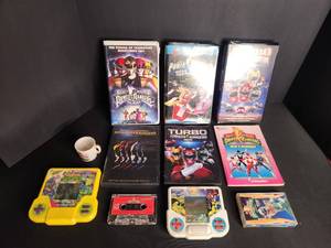 lot 70 image: Power Rangers Media lot. VHS tapes, movies, DVDs, cassettes, and More  tiger hand held and turtles tiger hand held
