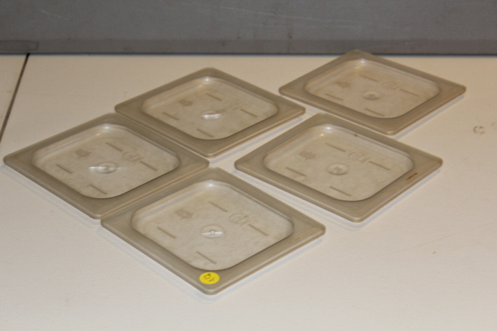 lot 59 image: 16 pan lids