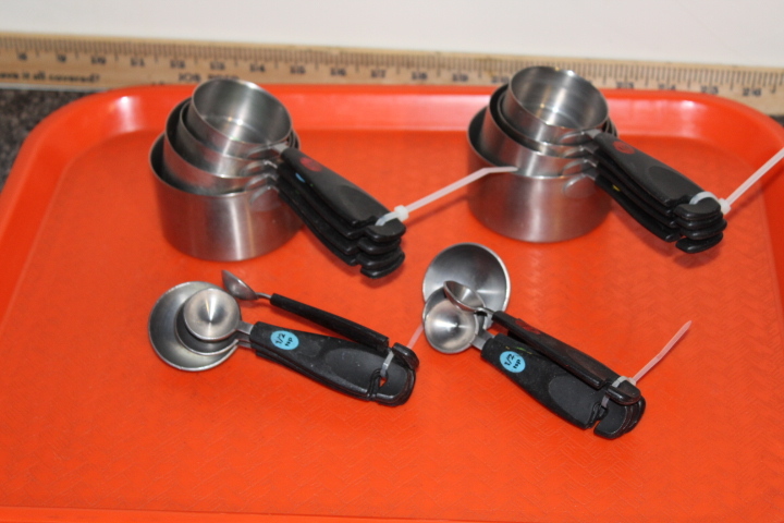 lot 99 image: Stainless measuring cups and spoons