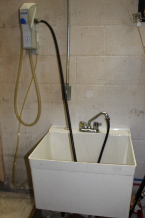 lot 75 image: Mop Sink with Faucet and Soap Dispenser