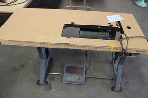 lot 20 image: Commercial Sewing Machine table with electric motor